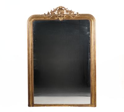 an image of a gold framed mirror on a white wall