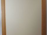 a picture of a mirror hanging on a wall