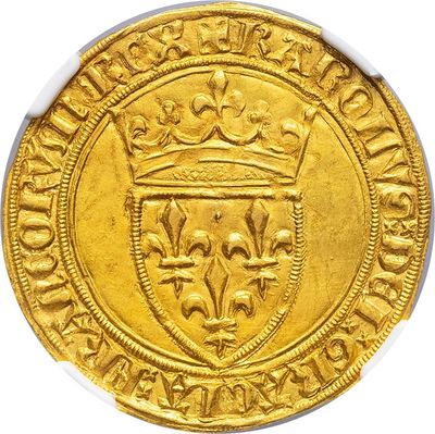 a close up of a gold coin with a crown on it