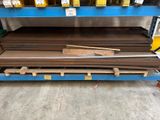 a close up of a stack of metal sheets on a pallet in a warehouse