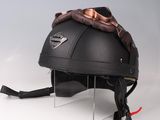 a black helmet with a brown scarf on top of it