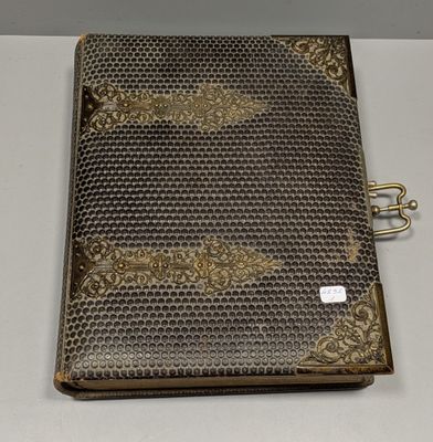 a close up of a book on a table with a binder attached to it