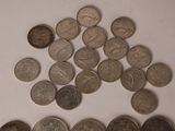 a lot of coins that are on a table