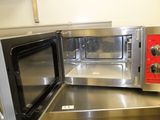 a microwave that is sitting on a counter in a kitchen