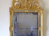 a mirror hanging on the wall in a room