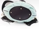 turquoise and black handbag with tassels on white background