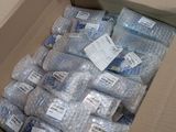a cardboard box full of water bottles and a bag of water