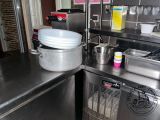a large pot sitting on top of a stainless steel counter