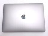 an apple logo on the back of an apple laptop