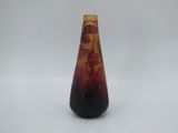 an image of a vase with a red and black design on it
