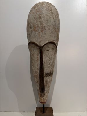 sculpture of a man ' s head with a long nose and a long nose