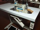 a sewing machine sitting on a table in a room