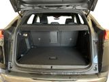 the back of a car with its trunk open showing the cargo compartment