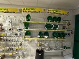 many green and white items on the shelves in the store