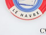 a red and white life preserver with a boat on it