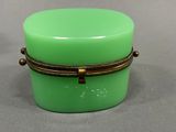 a small green box with a rope around it