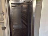 an image of a stainless steel refrigerator in a kitchen