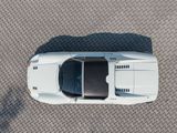 overhead view of a white sports car parked in a parking lot