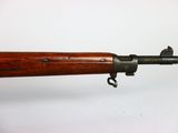 a close up of a rifle on a white surface with a white background
