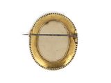 an image of a gold plated brooch with a pin on it