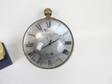 clock with roman numerals on the face and roman numerals on the face