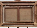 an old wooden easel with a canvas on it and a piece of wood sticking out of it