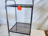 a metal stand with an orange ball on it