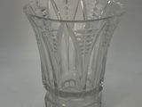 a clear glass vase sitting on a white table
