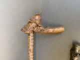 a statue of a man with a sword on the wall