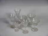 a group of wine glasses sitting on a table