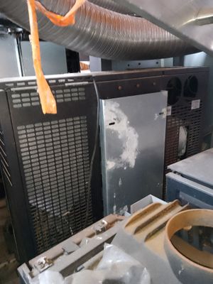 a dirty kitchen with a dirty stove and a dirty oven