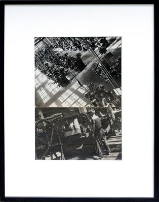 black and white photograph of a group of people in a building