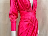 a mannequin dress with a pink wrap around the waist