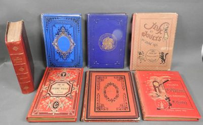 several books are lined up in a row on a table