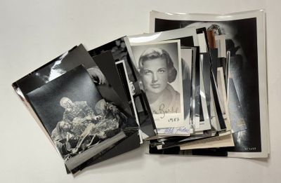 a pile of old photos and a picture of a woman