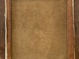 an old wooden frame with a brown linen backing