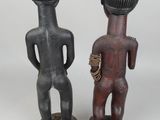 pair of african figurines of a man and a woman