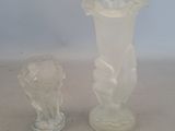 two vases that are sitting on a table