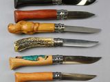six different types of knives are lined up on a table