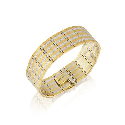 un bracelet en or orné de deux rangées de diamants blancs et jaunes