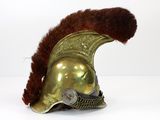 an image of a helmet with a feather on top of it