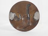 an image of a bronze plate with a cat and a bird on it
