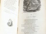 an open book with a picture of a man and a dog on it