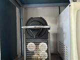 a microwave and a toaster sitting on a wooden floor