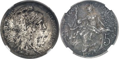 an old silver coin with a picture of a woman on it