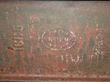 an old, rusted, rusted, rusted, and rusted metal container with a small hole in the bottom