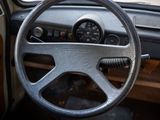 a steering wheel and dashboard of an old car