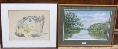 two framed pictures of a river and trees on the wall