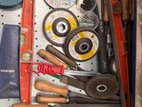 a drawer full of tools and tools that are on the shelf