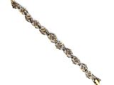 a close up of a gold and diamond bracelet on a white background